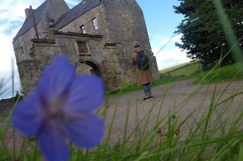 Midhope Castle (Lallybroch) with one of our ladies getting some space for that all important photograph.