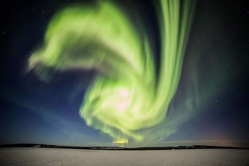 Magnificent Northern Lights on a frozen lake