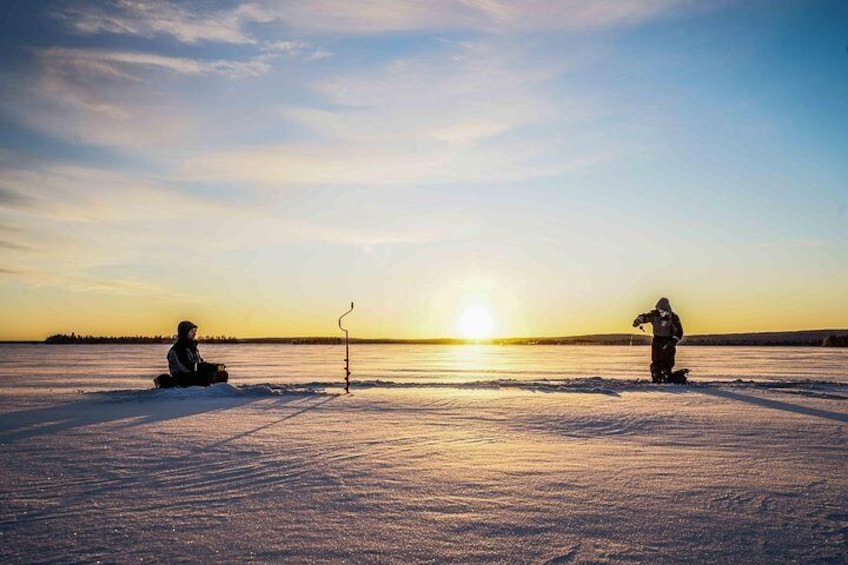 Ice fishing on a frozen lake