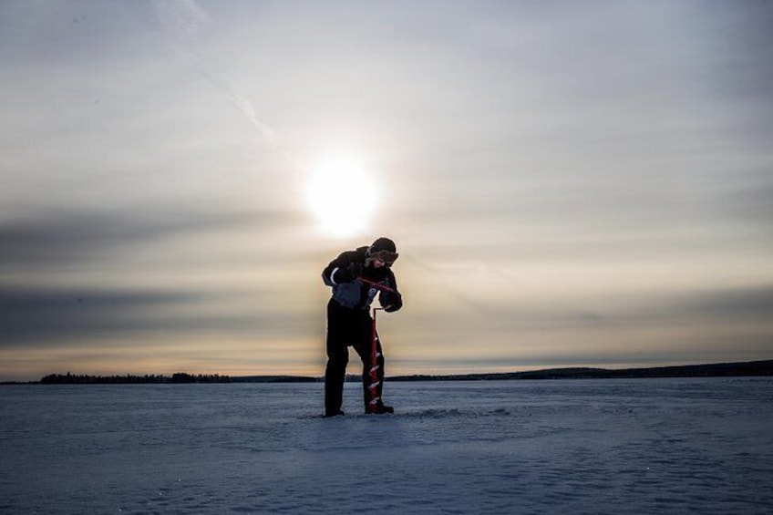 Ice fishing on a frozen lake