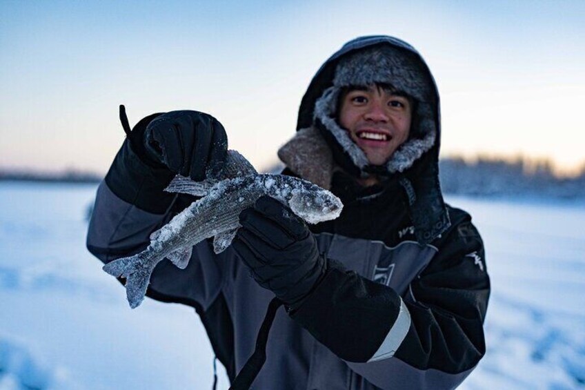 Ice fishing on a frozen lake