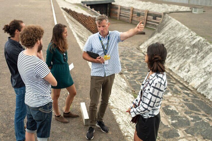 Guide and Group at the execution pit at Sachsenhausen