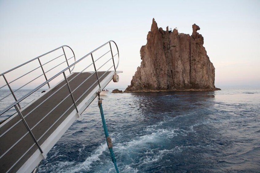 Motorboat approching Strombolicchio Rock