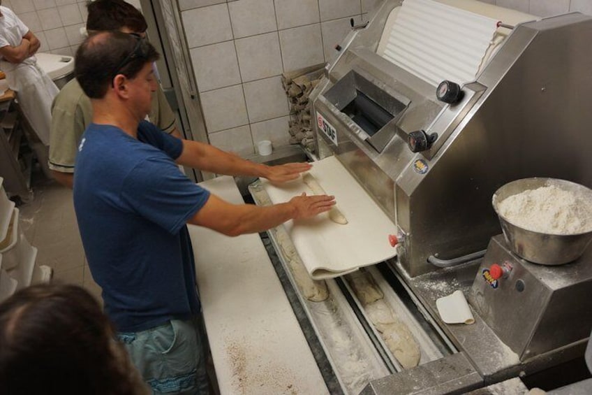 Guests enjoying the behind the scenes access of a "Boulangerie" (Bakery) with A Taste of Paris