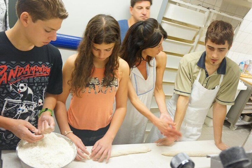 Guests enjoying the behind the scenes access of a "Boulangerie" (Bakery) with A Taste of Paris