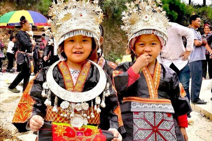 Miao girls attending a festival in their traditional costum and hairstyle in Guizhou Province of China 