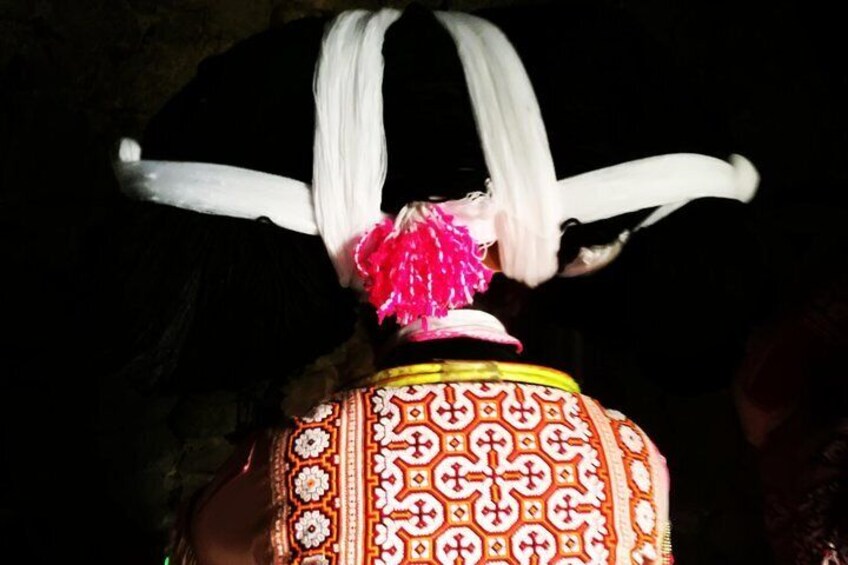 Special hairstyle and costume of the Long horn Miao villager 