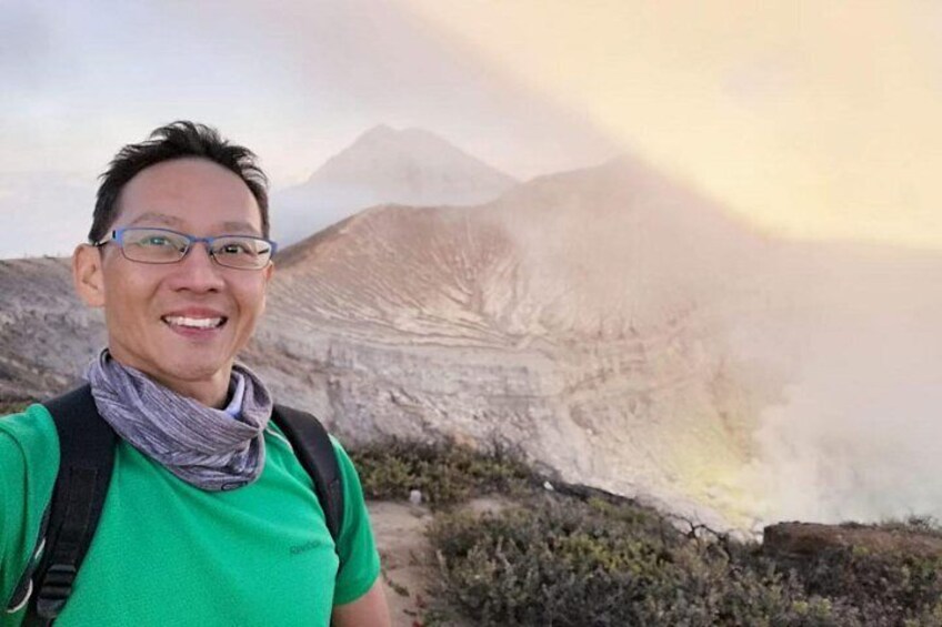 Solo traveller from Malaysia climbing up mount ijen.