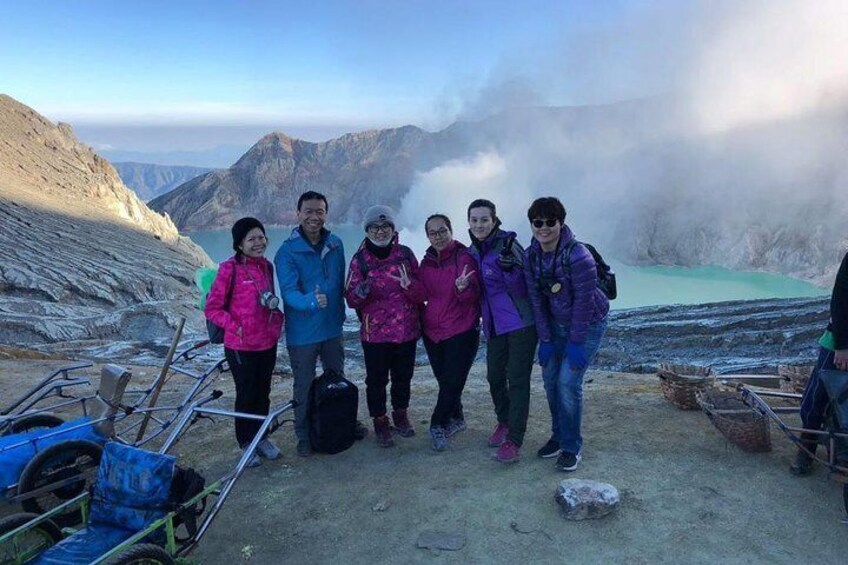 Group of friends on Ijen crater. 