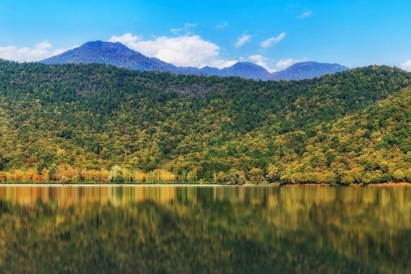 Magnificent view to the Caucasus Mountains through Nohurgol Lake