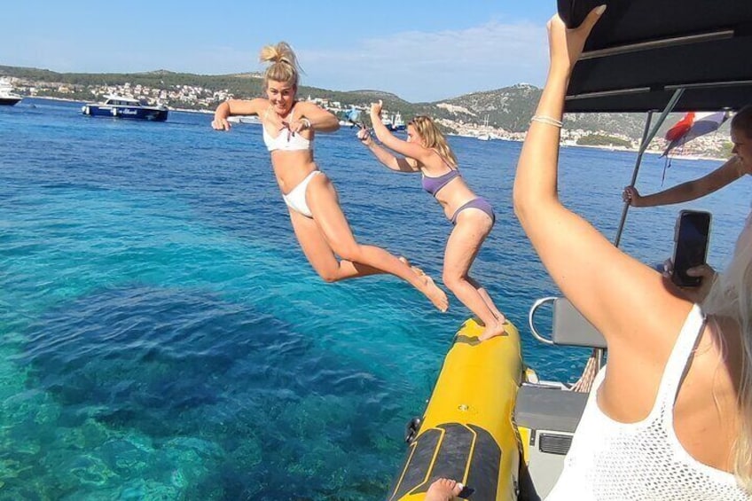 Guests chilling in beautiful bays on our Blue cave 5 islands tour from Split