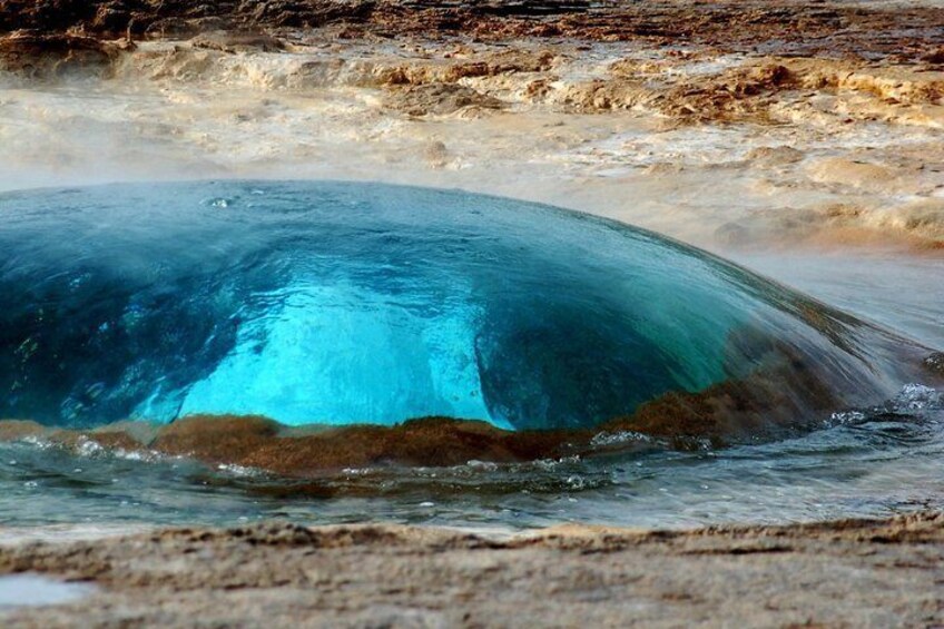 Geyser Strokkur right before its eruption 