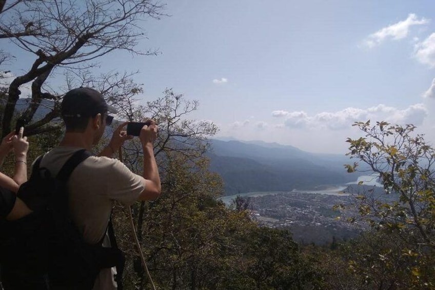 A tourist getiing pics of Rishikesh from Patho VIllage 