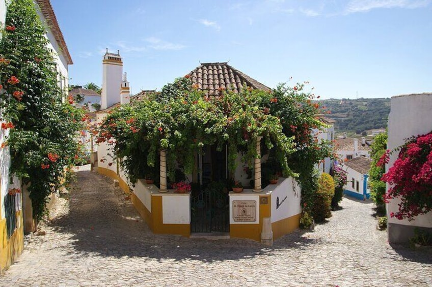 Obidos it’s also about animated festivals, bookstores, small museums, chocolate and ginjinha
