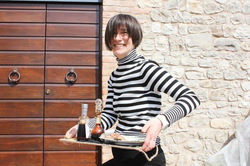 Host Mariangela serving some Italian produce paired with vinegar