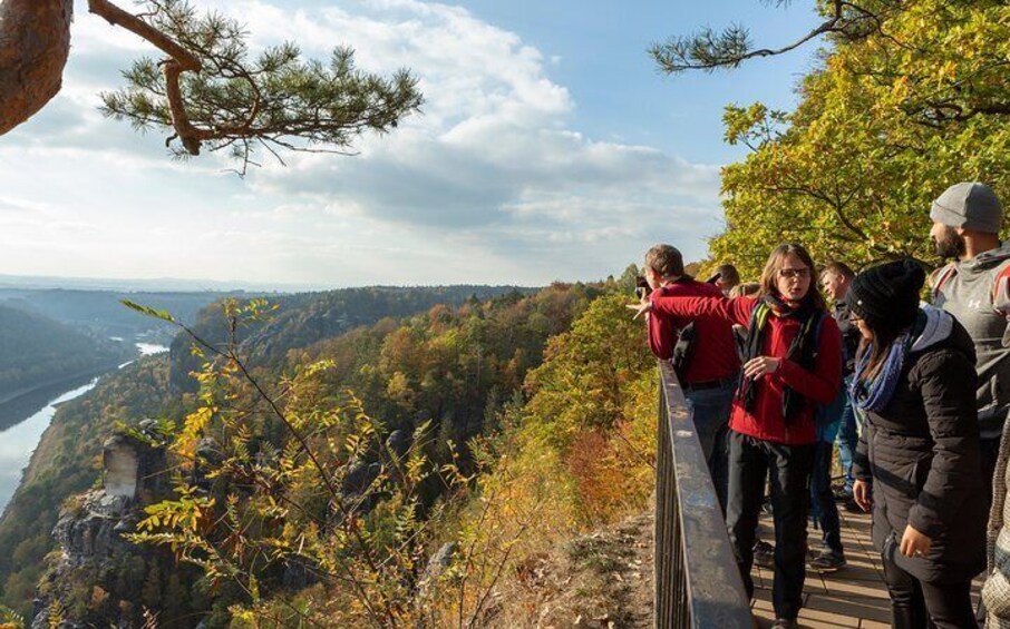 Travelers take in the scale of Saxon Switzerland National Park's Elbe Canyon.