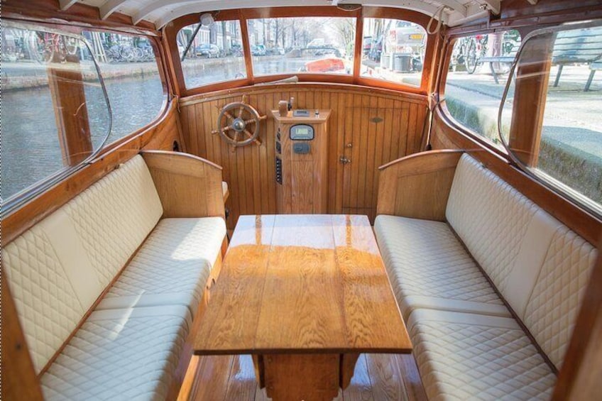 Enjoy the comfortable interior on your private salon boat cruise