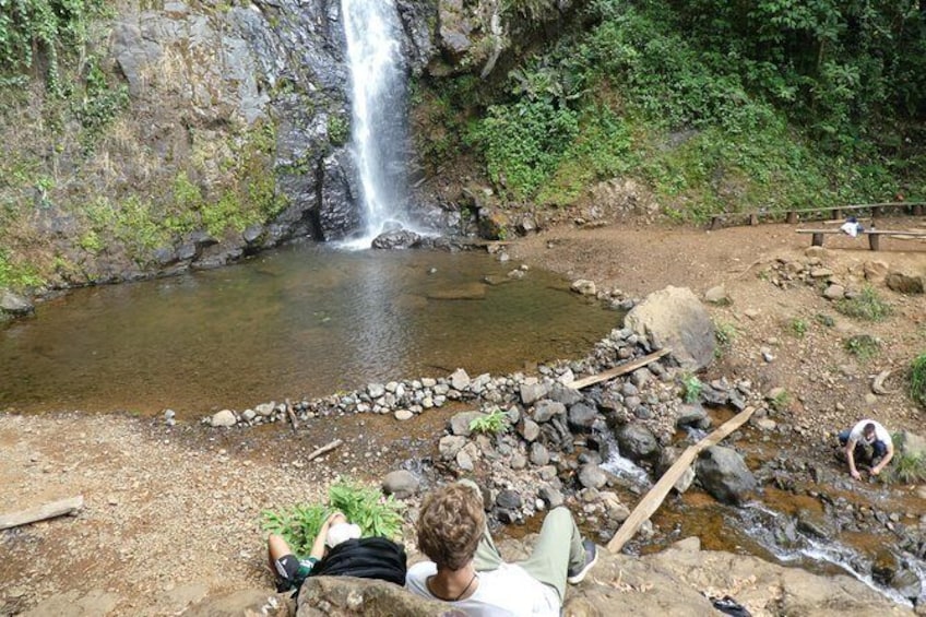 Show item 3 of 15. Relaxing around the waterfall