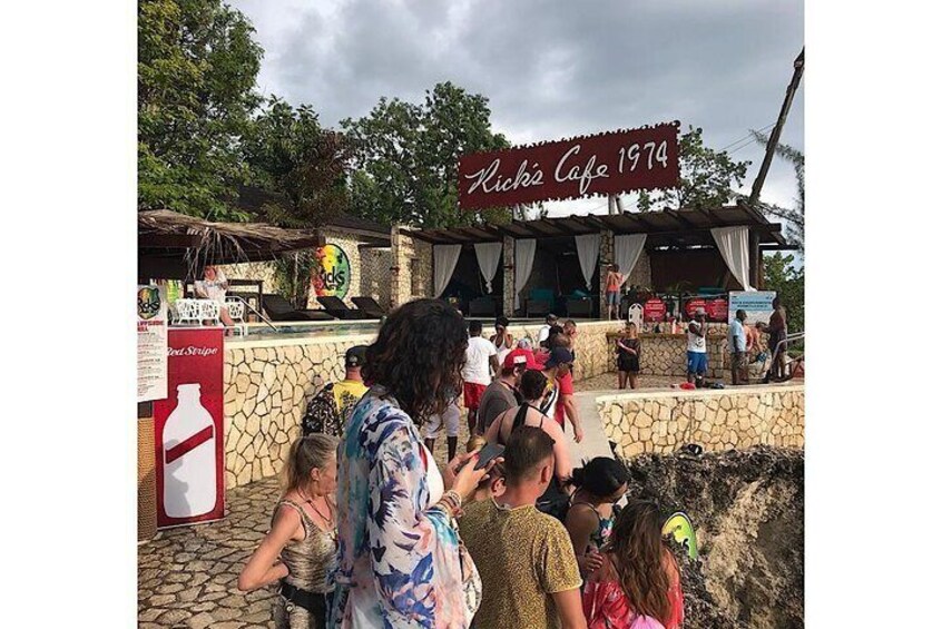 Patrons watching as cliff diving goes on