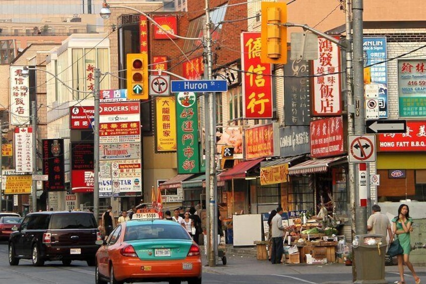 Chinatown District - Photo by dbking - https://creativecommons.org/licenses/by/2.0/legalcode - https://commons.wikimedia.org/wiki/File:Dundas_Street_West_at_Huron_Street_Toronto_2010.jpg