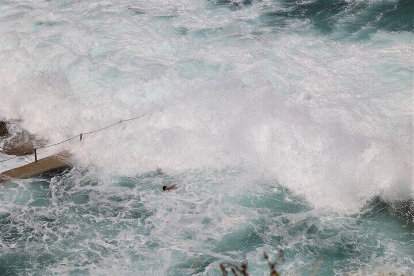 ocean pool assaulted by wave