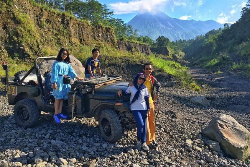 Taking family photo with the jeep and merapi volcano view