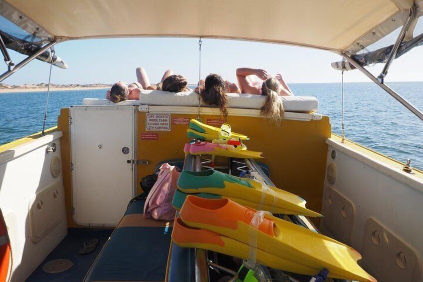 Soaking up the plentiful sunshine on the day bed between snorkel sites. 