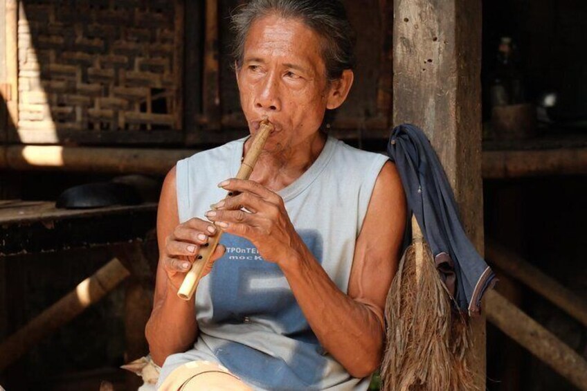 An old man with flute