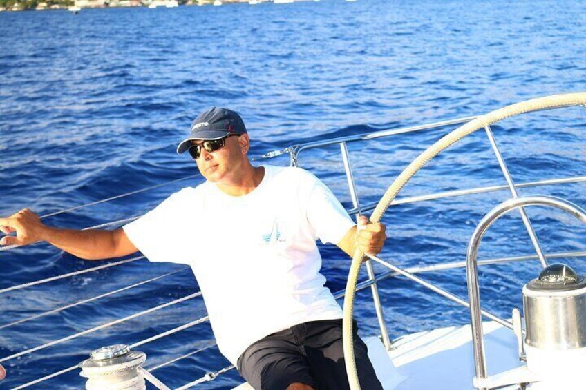 Captain with his eyes on the wind.