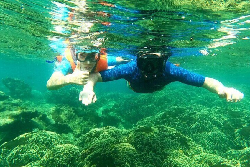 Dad and son snorkeling at Coral Mountain, Phu Quoc Island, Vietnam