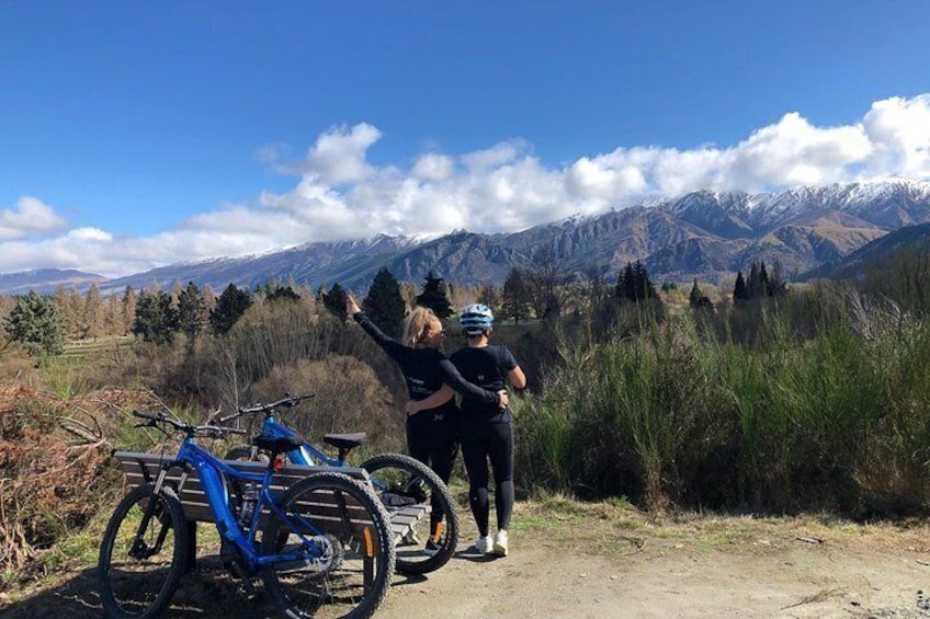 Friends riding Ebikes together and enjoying the views of Queenstown