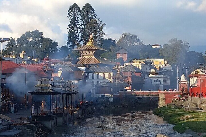 Watch Hindu, devotees, ascetics and cremation at Pashupatinath. 