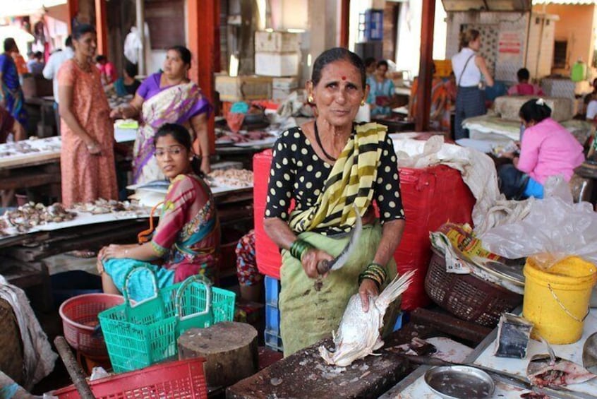 A Beautiful Lady serving fresh fish