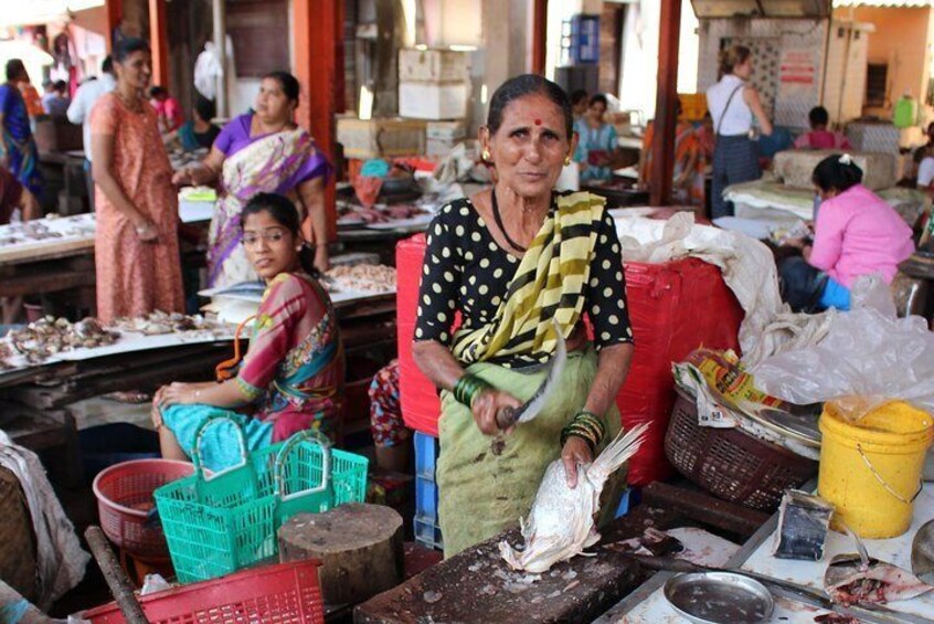 A Beautiful Lady serving fresh fish