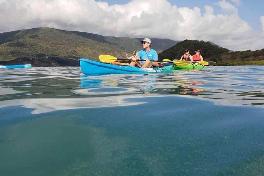 Paddling over Double Island reef.