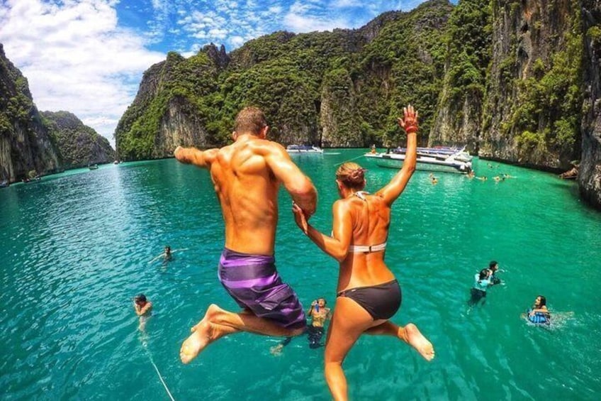 Jump into the emerald green waters of Pileh Lagoon surrounded by sheer limestone cliffs