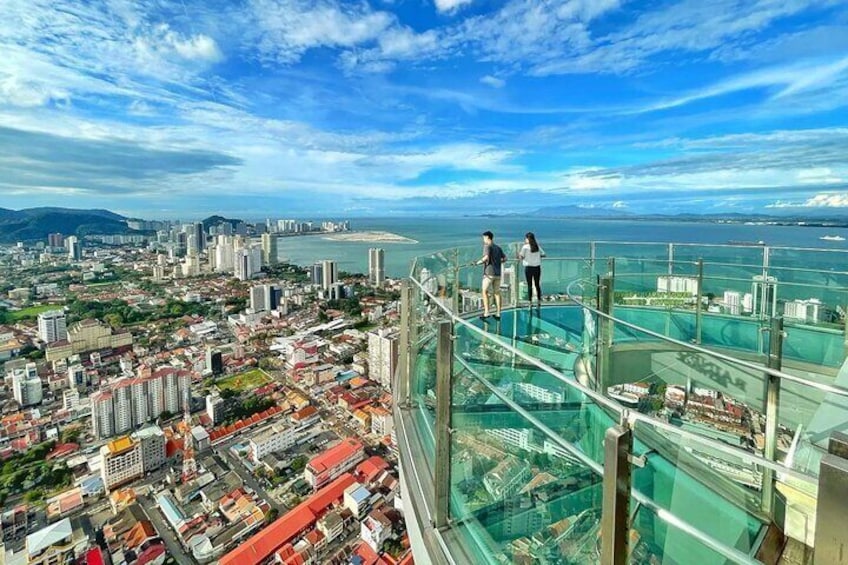 Face your fear of height with a thrilling walk (249m above ground) at the Window of the Top central attractions: Penang Rainbow Skywalk and Observatory Deck