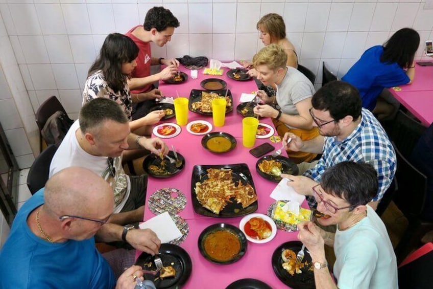 Trying out the traditional dish, murtabak