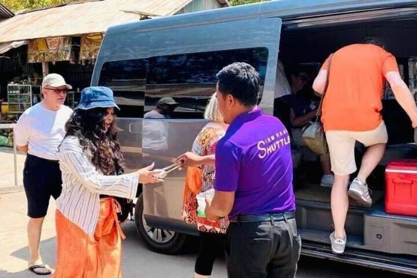 A free cold bottle of water and face towel are provided on the tour of Kulen Waterfall tour 