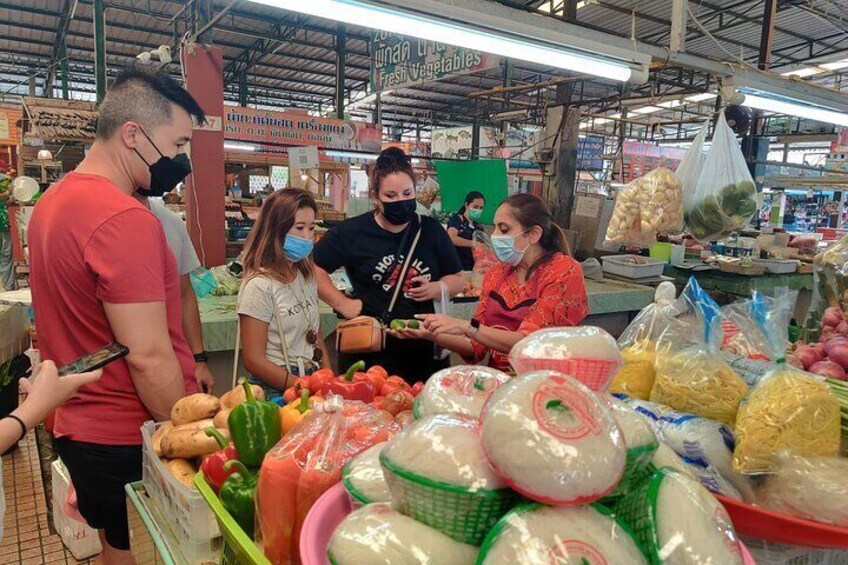 Fruit tasting, selecting and buying ingredients at the market