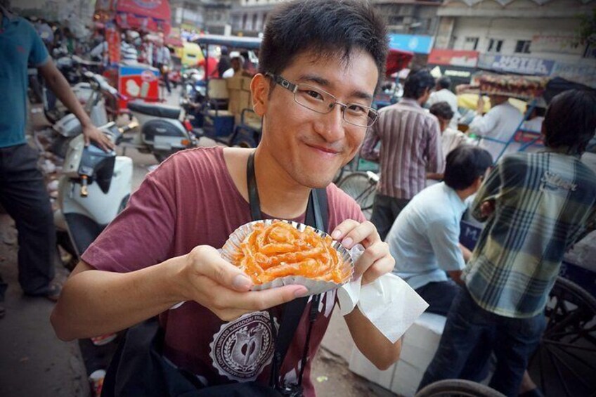 A guest about to enjoy a jalebi