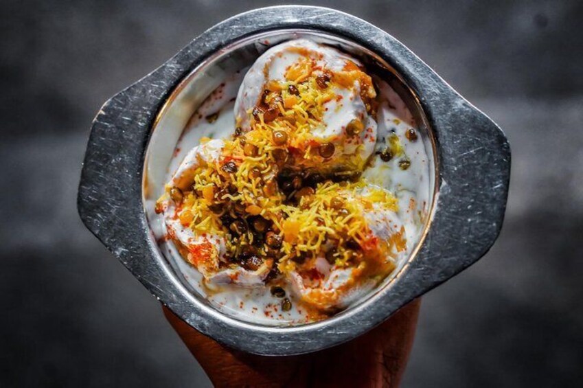 This isn't any ordinary puri - this is the yogurt-drenched pomegranate-topped dahi puri. 