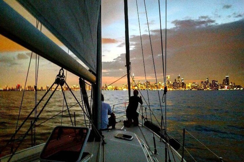 Capturing the city lights at dusk. The best place to view the city at night is on our sailboat.