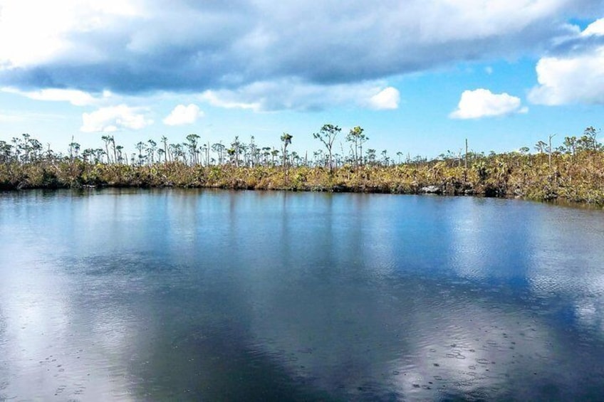 Blue Hole with a passing rain cloud