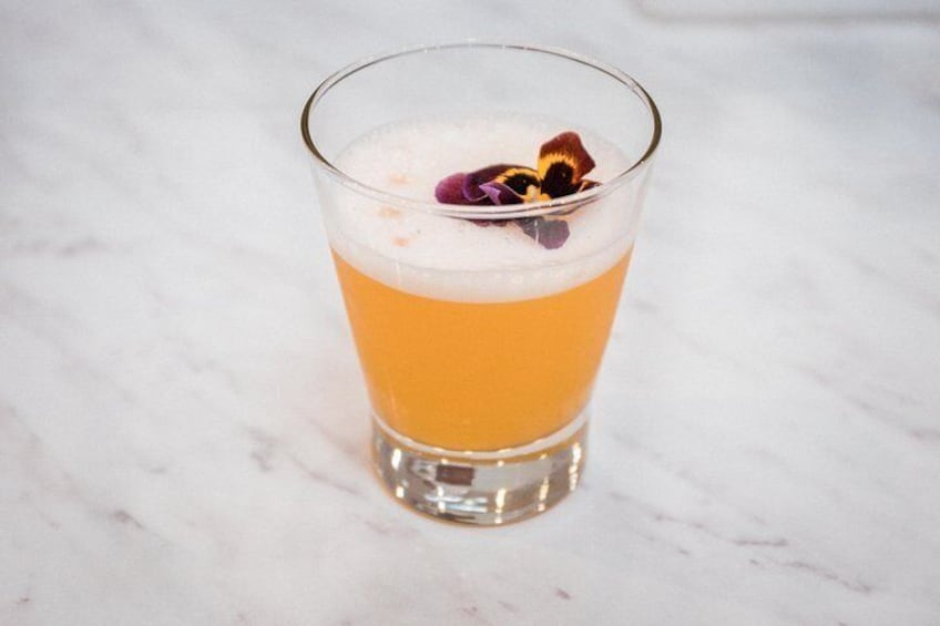 There are many ways to make the famous Peruvian pisco sour cocktails, and the basic recipe includes pisco brandy, simple syrup, and lime juice.