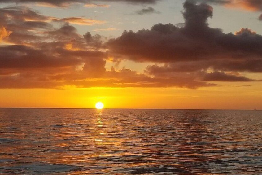 Cloud formations make the tropical sunset even more dramatic. It is photo time!