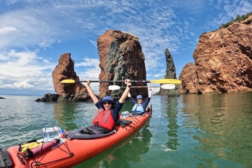 Stoked to be paddling in front of the Three Sisters at high tide