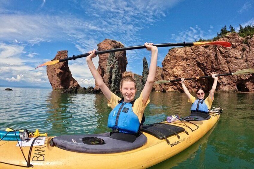 Happy kayakers by the Three Sisters, Cape Chignecto