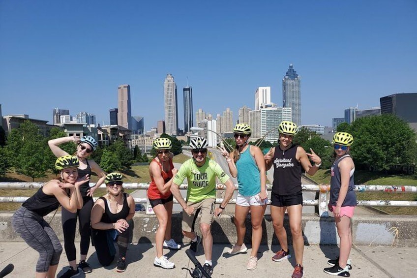 Striking a pose on the Jackson Street Bridge for iconic skyline view in the background.