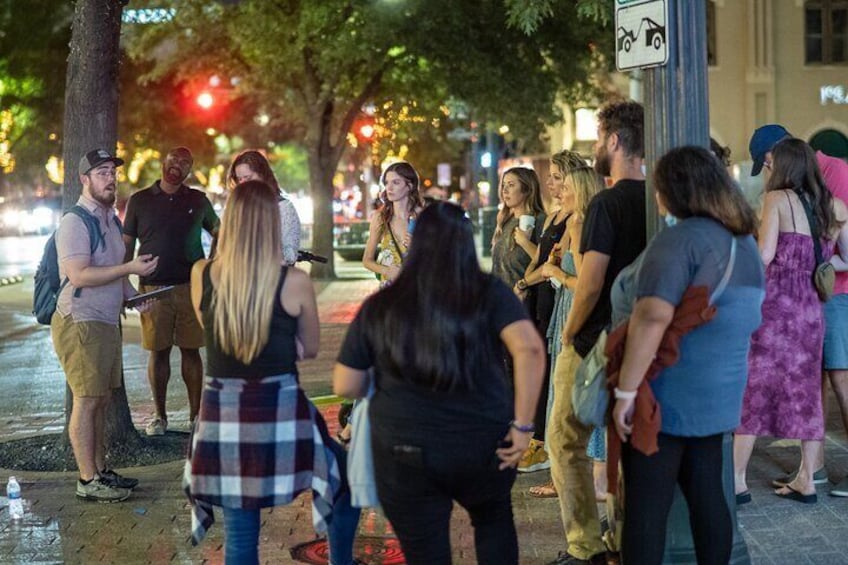 Our guide reveals the details of a possible suspect outside the historic Speakeasy Tavern